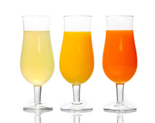 Tropical juices in glasses isolated on white