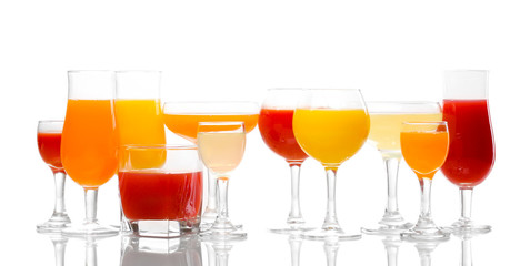 Tropical juices in glasses isolated on white