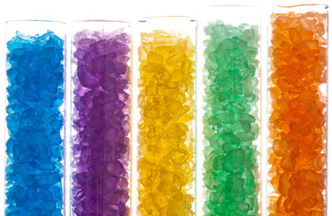 colorful salt cristals in lab glass test tubes