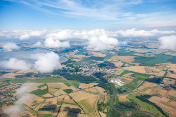 aerial view of village landscape over clouds