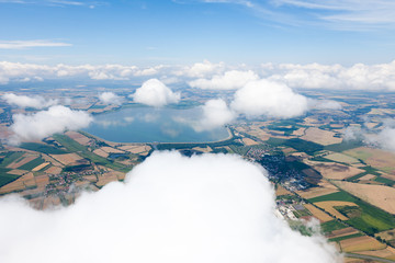 aerial view of village landscape over clouds © mariusz szczygieł
