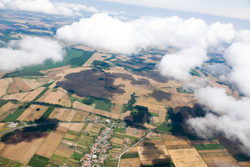 aerial view of village landscape over clouds