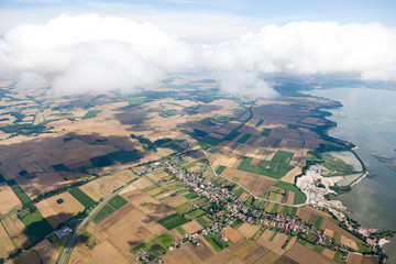 aerial view of village landscape over clouds