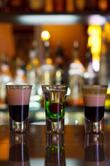 three cocktails layered shots