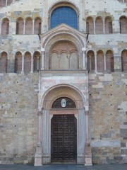 Fototapeta na wymiar The entrance of the cathedral of Parma in Italy