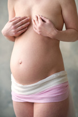 Fototapeta na wymiar Pregnant woman standing