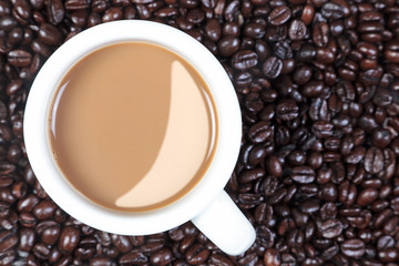 Overhead mug of coffee and beans
