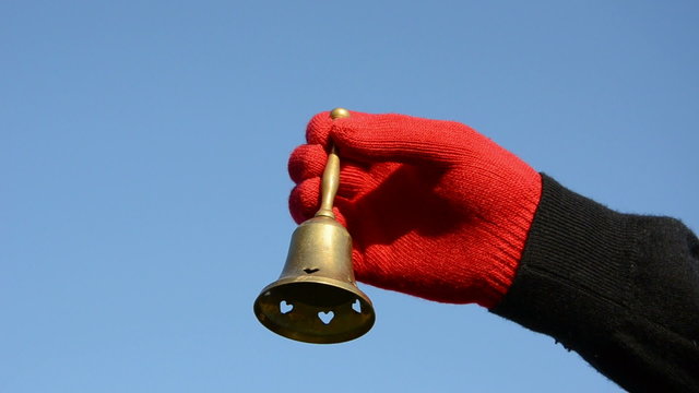 vintage brass bell in the hand and beautiful sound