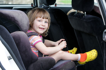 happy child in carseat