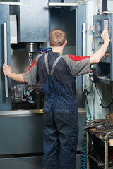 worker at machining tool workshop