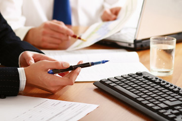Colleagues working together in office