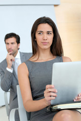 Business people attending conference