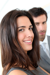 Portrait of business people standing in hall