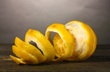 ripe lemons on wooden table on grey background