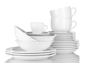 empty bowls, plates and cups on gray background