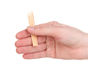 Toothpicks in hand isolated on white