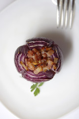 baked onion with bacon and parsley