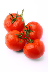 Bunch of delicious fresh tomatoes isolated on white background