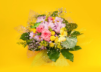 bunch of flowers on yellow background
