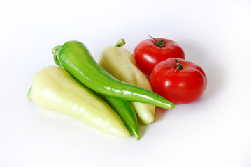 tomatoes and papricas isolated on white background