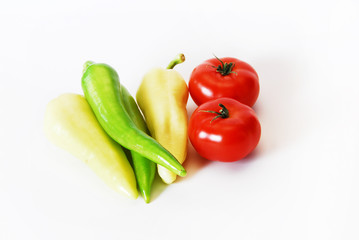 tomatoes and papricas isolated on white background