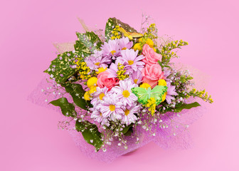 bunch of flowers on pink background