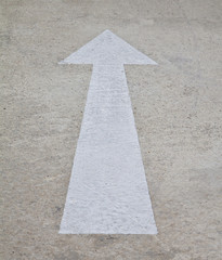 white arrow on the road