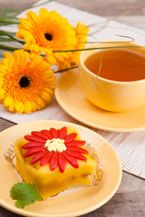 tea with cake and gerberas flowers