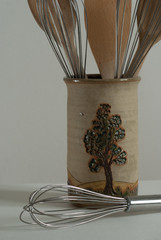 rustic pot with kitchen utensils