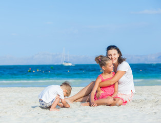 Happy family on tropical beach