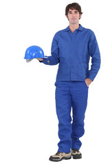 A construction worker dressed all in blue.