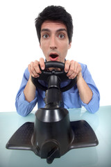Fototapeta premium man testing a car driving simulator