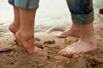 Fototapeta na wymiar Feet of loving couple