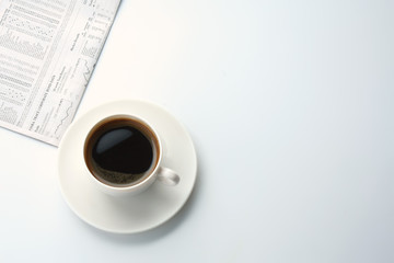 Coffee over newspaper