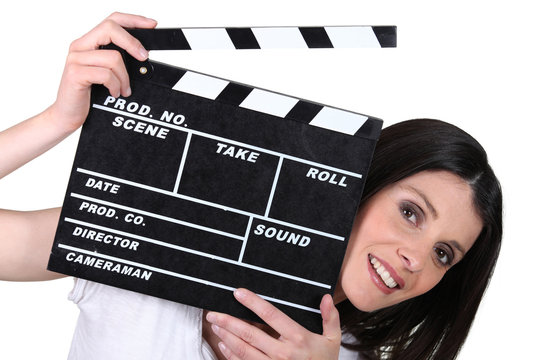 woman holding a clapper board