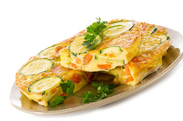 omelette with carrot zucchinis and parsley