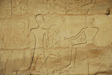 Egyptian hieroglyphs engraved on stone in Horus temple, Egypt