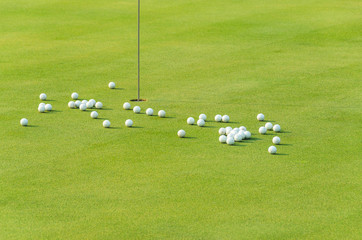 group of practice golf ball on green