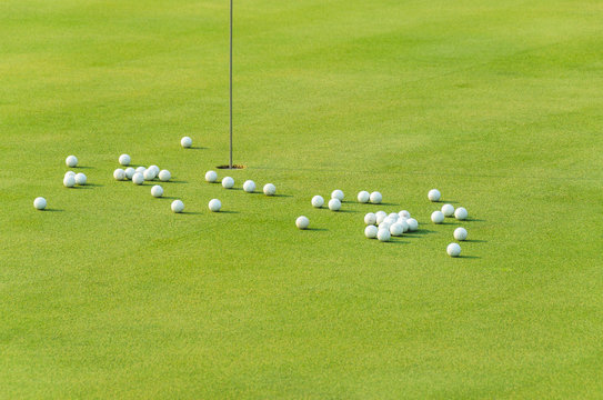 group of practice golf ball on green