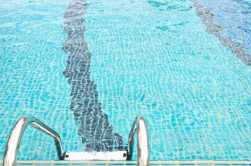 stairway to swimming pool on aqua blue background