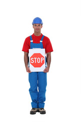 Man holding stop sign