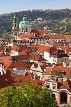 View of red roofs in Prague, cityscape of the historic city center on summer sunny day