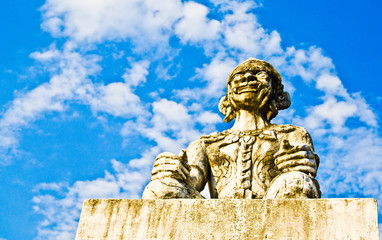 Giant in front of thai church with blue sky