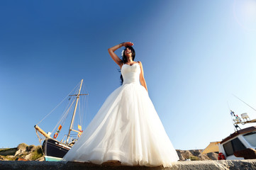A bride in a Santorini port