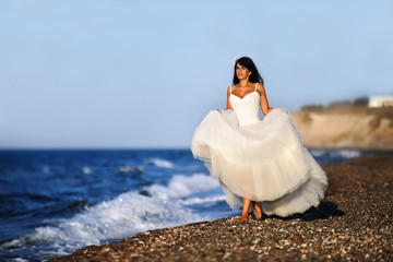 A bride on a beach in Santorini