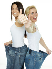 Beautiful girls are proud to lose weight - showing thumb up