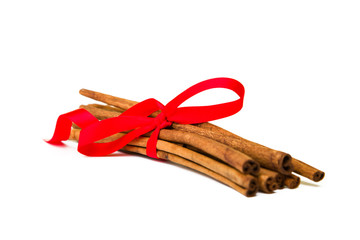 Composition of spices with cinnamon sticks isolated on white