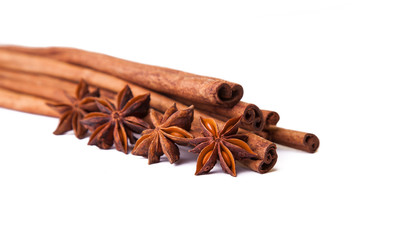 Composition of spices with cinnamon sticks isolated on white