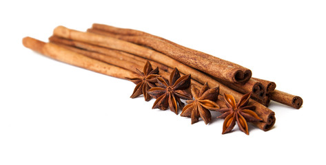 Composition of spices with cinnamon sticks isolated on white