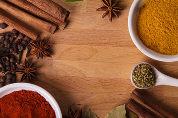 Frame composition of spices on wood,anise,cinnamon,laurel